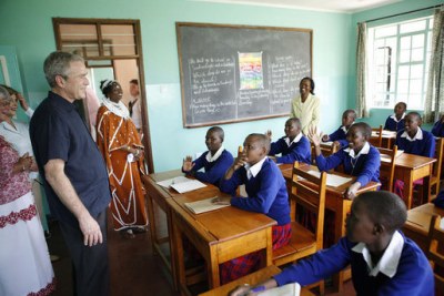 Former U.S. President George W. Bush visits with students in a classroom in Arusha, Tanzania (file photo).