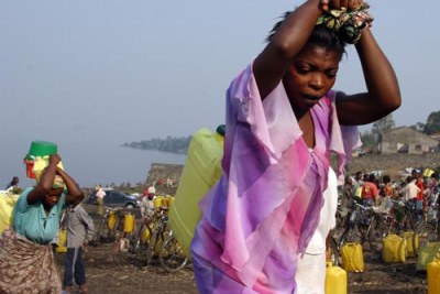 Women carry jerry cans of water in north Kivu, eastern DRC