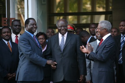 President of Kenya, Mwai Kibaki, shakes hands with opposition leader Raila Odinga during peace talks in Nairobi, Kenya, January 2008. Peace talks have been ongoing, led by former UN Secretary-General Kofi Annan.