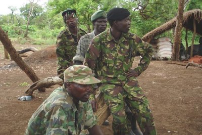 Some of the LRA soldiers sit outside, Sudan, April 2007.