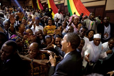 President Barack Obama greets spectators after making a speech to the Ghanaian Parliament in Accra on July 11, 2009.