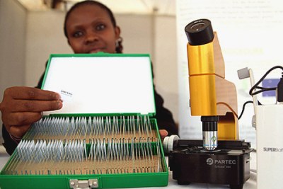A newly-developed microscope, complete with ready-to-use malaria test slides, on display at an international malaria conference in Nairobi.