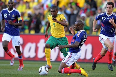 Katlego Mphela of South Africa tackled by William Gallas of France during the 2010 World Cup (file photo).