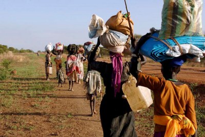 Fleeing large-scale fighting (file photo): Abyei was due for a referendum in 2011 to decide whether the area would remain in Sudan or become part of South Sudan.