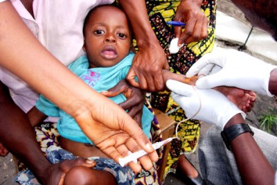 A child suffering from sleeping sickness being injected with arsenic, in the Democratic Republic of the Congo, May 2006.