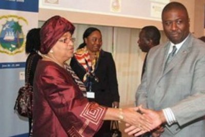 President Sirleaf and Richard Tolbert, former investment boss who resigned following his suspension