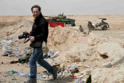 Anton Hammerl taking photographs on the Brega frontline in Libya before his disappearance.
