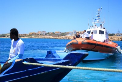 Passengers wait to disembark at Lampedusa port (file photo).