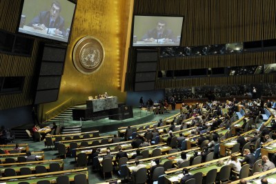 Nassir Abdulaziz Al-Nasser (on screens), president of the UN General Assembly, chairs the meeting which accepted the new government's credentials.