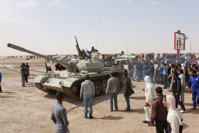 Armed rebels commandeer a tank (file photo).