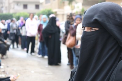 Hayam Yousef, a mother of three, waits in line for her turn to vote in Egypt's first elections (file photo).