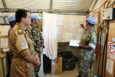 United Nations Mission for the Referendum in Western Sahara (MINURSO) troops participate in a briefing before going on patrol in Mahbas, Western Sahara.