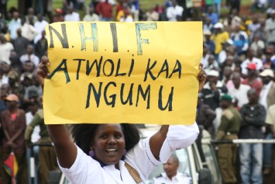 A worker marches during celebrations to mark Labour Day at Uhuru Park.