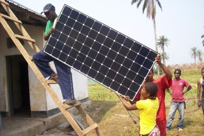 Installing a solar panel (file photo).