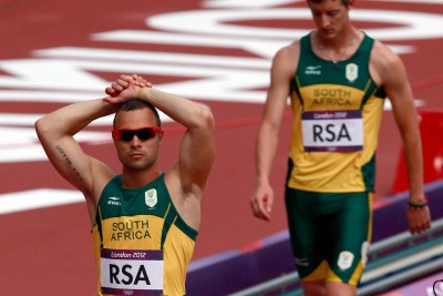 A dejected Oscar Pistorius after South Africa was forced out of the men's 4x400m relay.