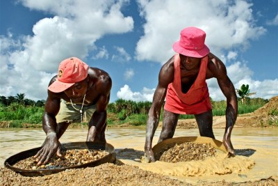 Artisanal diamond miners at work in an open-pit mine.