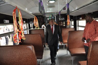 The Minister for Works Dr. Harrison Mwakyembe inspects one of the city commuter trains in Dar es Salaam.