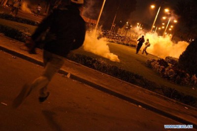 Protesters clash with riot police during an anti-Morsi protest in front of the presidential palace (file photo).