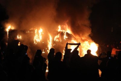 Protesters set fire to police armoured vehicle (file photo).