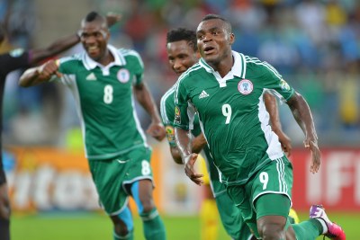 Nigeria's Emmanuel Emenike, 9, celebrates one of the goals which have made him the tournament's top scorer.