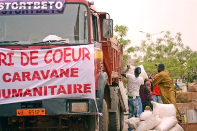 Food aid is loaded onto trucks in Bamako: Humanitarian access is improving in Mali but the situation remains volatile.