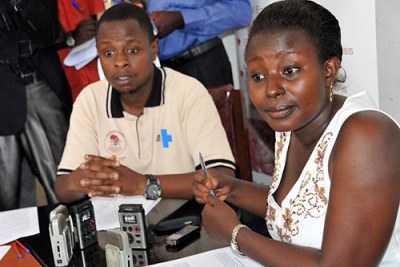 ANPPCAN research coordinator Ruth Birungi and Information officer Maron Agaba at a news conference.