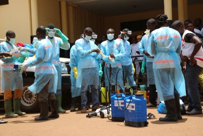 Volunteers with the Guinea Red Cross disinfect the Ratoma hospital in Tahouay, suburb of Conakry, following the outbreak of the Ebola virus (file photo).