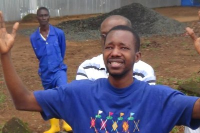 An Ebola survivor rejoices upon being released from an isolation center.