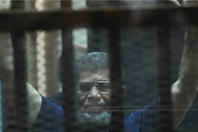 Ousted president Mohamed Mursi on trial.