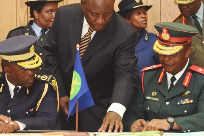 Lesotho security chiefs signing an electoral pledge ahead of the February 2015 polls. The security forces remain unreformed and riven by factional disputes.