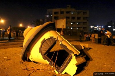 Debris is seen on the ground after a bomb blast at a national security building in Shubra Al-Khaima on the outskirts of Cairo.