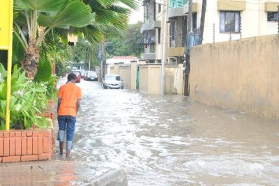 A young boy tries to find his way through the rain waters after heavy downpour in Mombasa (file photo).