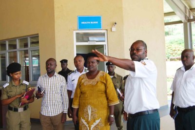 An immigration official guides Internal Affairs Minister Rose Akol around Mirama-Kagitumba border post offices (file photo)