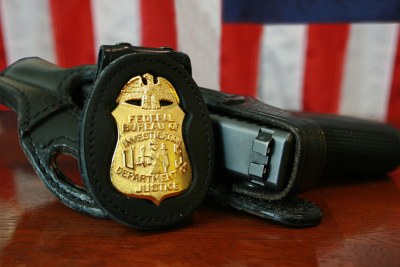 FBI badge and service pistol