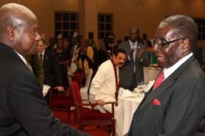Presidents Yoweri Museveni (left) and Robert Mugabe.