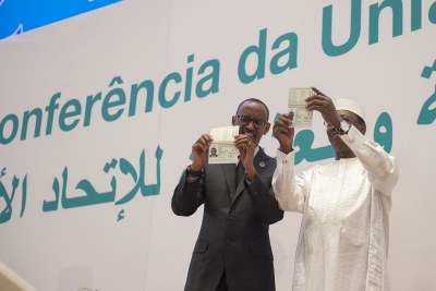President Paul Kagame and President Idriss Deby Itno showing off the new passport (file photo).