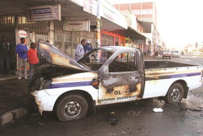 A police van burnt during protest in Harare.