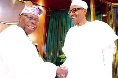 President Muhammadu Buhari receiving former president Olusegun Obasanjo, left (file photo).