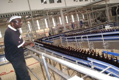 Beer bottles go through a production line (file photo).