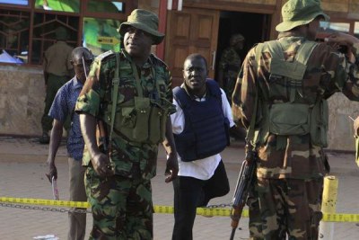 Mandera County Police Commander Bernard Nyakwaka (left) at the scene of an attack by suspected al-Shabaab terrorists in Mandera.