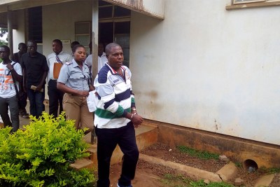 Genocide suspect Vincent Murekezi leaves a court in Malawi (file photo)