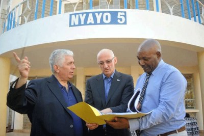 World Under-18 Athletics Championship Local Organising Committee Chief Executive Officer Mwangi Muthee (right) goes through the village Map with IAAF Head of Events Operations Carlo De Angeli and Head of Competition management Luis Saladie (left) .