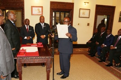President John Magufuli and the new team sworn-in to probe mineral sands.