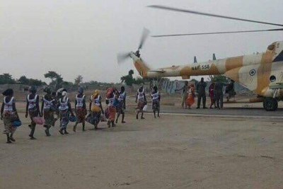 Chibok schoolgirls get on helicopter..