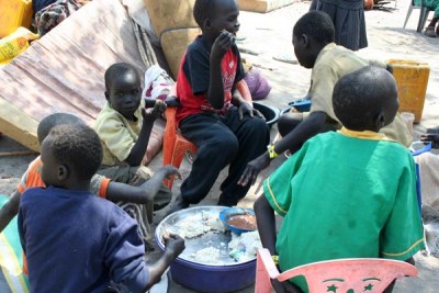 South Sudan refugee Children eating food.