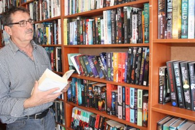 Veteran South African used book seller Eric Nofal says new titles cost too much in the country.