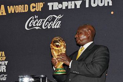President Yoweri Museveni with the Fifa world cup trophy at State House, Entebbe on November 15, 2009. The trophy was on a 52-nation tour of Africa in the run-up to the 2010 FIFA World Cup tournament.