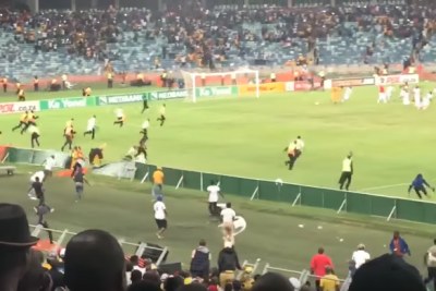 Video screenshot of Kaizer Chiefs fans invading the pitch at Moses Mabhida Stadium after their team lost 2-0 to Free State Stars.