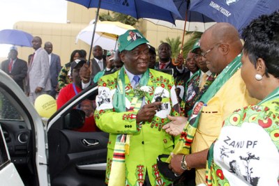 President Mnangagwa hands over keys to one of the vehicles bought for the election campaign to Manicaland provincial chairman Mike Madiro after the launch of the party’s election manifesto in Harare. Looking on is First Lady Auxilia Mnangagwa