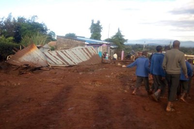 Residents leave after their houses were destroyed by floodwaters from Patel Dam in Solai Ward, Subukia.